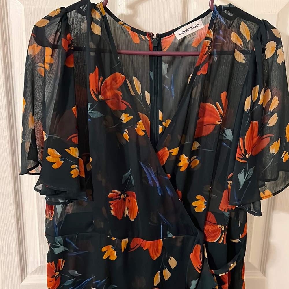 Calvin Klein floral chiffon faux wrap dress with flutter sleeves.  Size 14